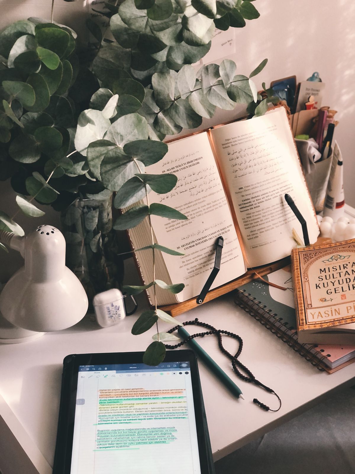 Books and a tablet arranged for digital reading